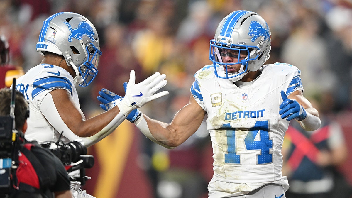 Amon-Ra St. Brown celebrates a touchdown