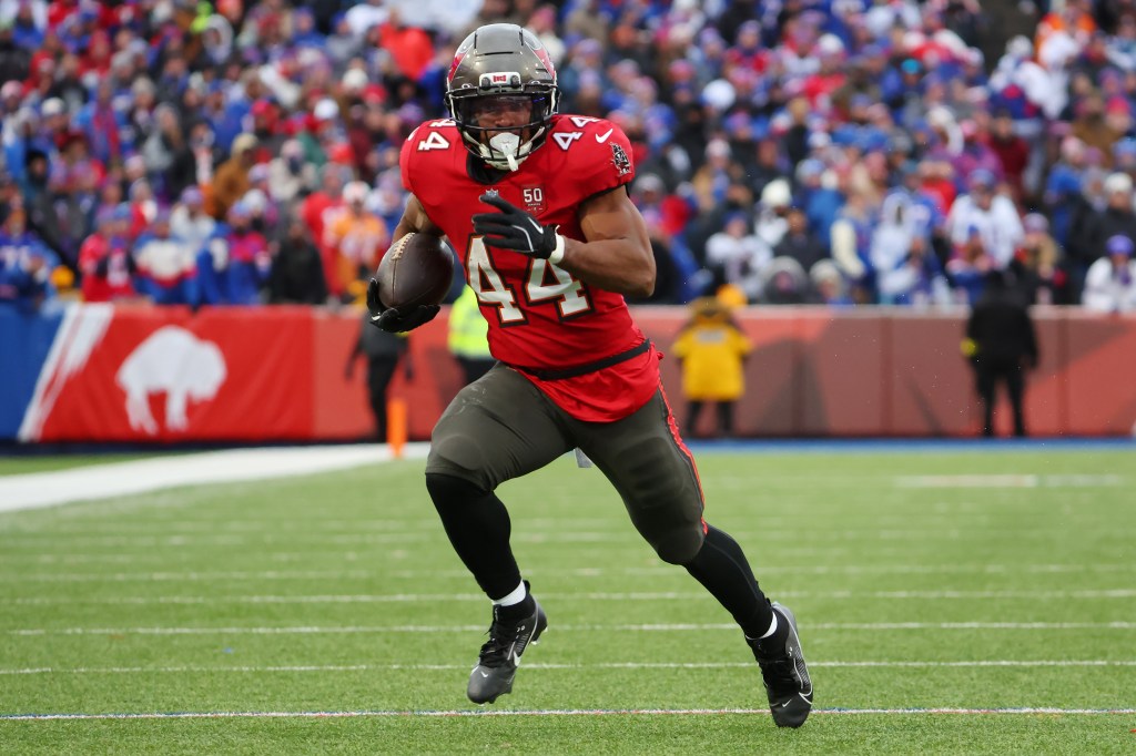 Sean Tucker, #44 of the Tampa Bay Buccaneers, running the ball for a touchdown against the Buffalo Bills.