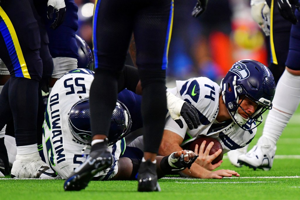 Seattle Seahawks quarterback Sam Darnold (14) dives for a first down against the Los Angeles Rams at SoFi Stadium.