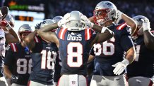 Nov 2, 2025; Foxborough, Massachusetts, USA;  New England Patriots wide receiver Stefon Diggs (8) celebrates his touchdown against the Atlanta Falcons with teammates during the first half at Gillette Stadium. Mandatory Credit: Eric Canha-Imagn Images