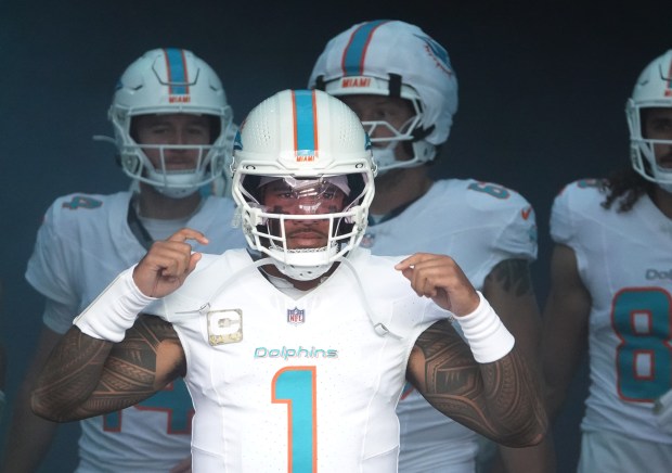 Miami Dolphins quarterback Tua Tagovailoa takes to the field before...