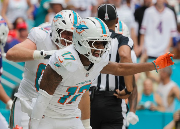 Miami Dolphins wide receiver Jaylen Waddle celebrates a touchdown catch...