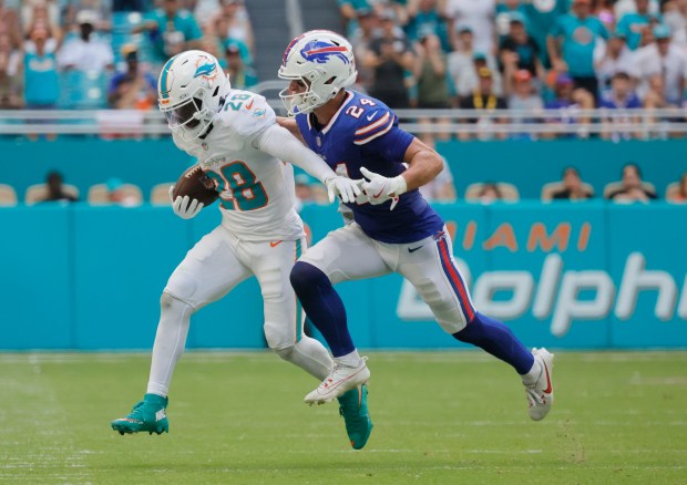 Miami Dolphins running back De'Von Achane is chased out of...