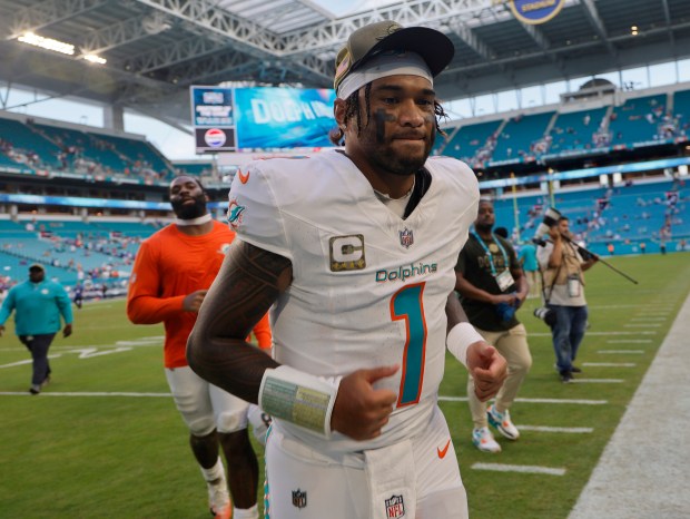 Miami Dolphins quarterback Tua Tagovailoa leaves the field after the...