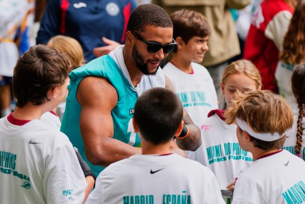 Miami Dolphins Dante Trader Jr (11) attends a Miami Dolphins Community Flag Football Clinic in Madrid, Spain, Friday, Nov. 14, 2025, ahead of Sunday's NFL football game against Washington Commanders. (AP Photo/Manu Fernandez)