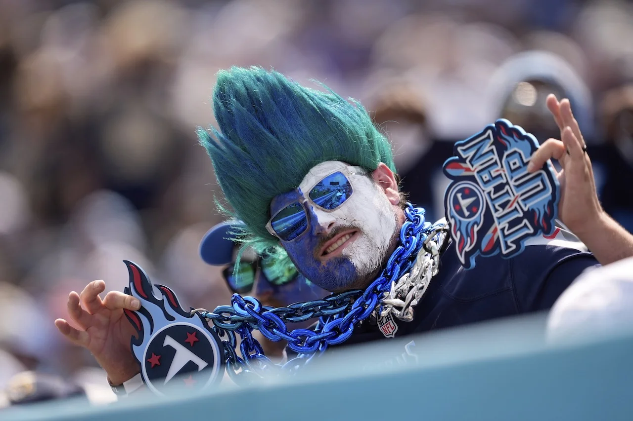 A Tennessee Titans fans mugs for the camera during the first half of an NFL football game between the Titans and the Los Angeles Rams Sunday, Sept. 14, 2025, in Nashville, Tenn. (AP Photo/George Walker IV)