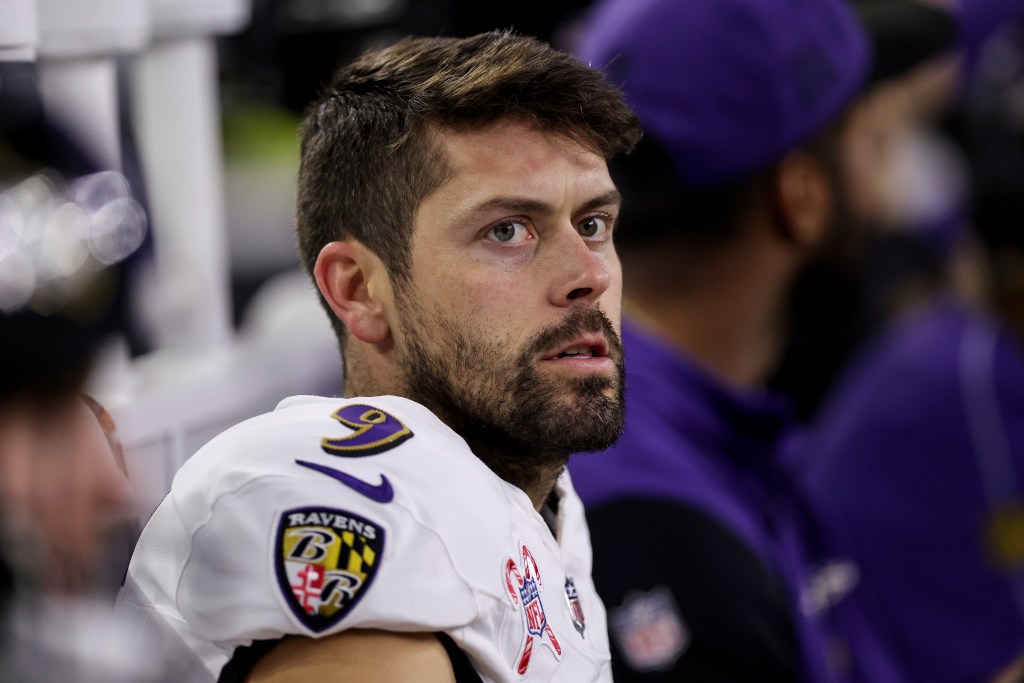 Justin Tucker #9 of the Baltimore Ravens sits on the bench in the second half against the Houston Texans at NRG Stadium on December 25, 2024 in Houston, Texas.