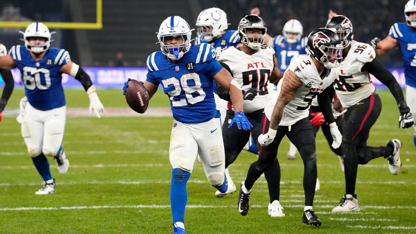 Taylor runs for 244 yards and 3 TDs for Colts in 31-25 OT win over Falcons in Berlin