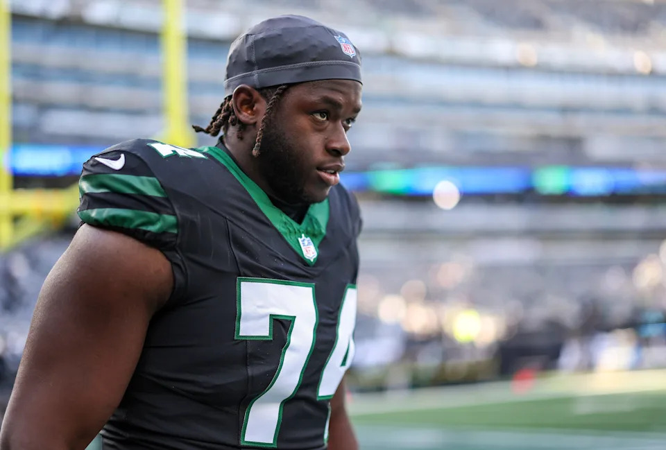 EAST RUTHERFORD, NEW JERSEY - DECEMBER 01: Olu Fashanu #74 of the New York Jets looks on while warming up before a game against the Seattle Seahawks at MetLife Stadium on December 01, 2024 in East Rutherford, New Jersey. (Photo by Elsa/Getty Images)