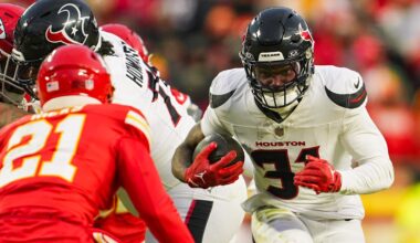 Jan 18, 2025; Kansas City, Missouri, USA; Houston Texans running back Dameon Pierce (31) runs the ball against Kansas City Chiefs safety Jaden Hicks (21) during the second half in a 2025 AFC divisional round game at GEHA Field at Arrowhead Stadium. Mandatory Credit: Jay Biggerstaff-Imagn Images