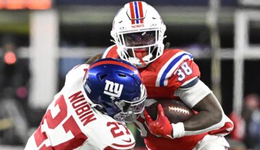 Dec 1, 2025; Foxborough, Massachusetts, USA; New England Patriots running back Rhamondre Stevenson (38) runs the ball against New York Giants safety Tyler Nubin (27) during the fourth quarter at Gillette Stadium.