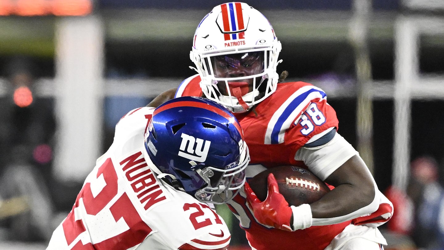 Dec 1, 2025; Foxborough, Massachusetts, USA; New England Patriots running back Rhamondre Stevenson (38) runs the ball against New York Giants safety Tyler Nubin (27) during the fourth quarter at Gillette Stadium.