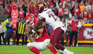Oct 27, 2025; Kansas City, Missouri, USA; Kansas City Chiefs tight end Travis Kelce (87) makes a reception for a touchdown defended by Washington Commanders safety Darnell Savage (25) during the third quarter of the game at GEHA Field at Arrowhead Stadium. Mandatory Credit: Denny Medley-Imagn Images