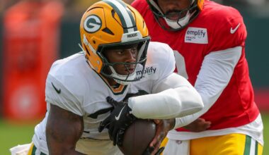 Green Bay Packers running back MarShawn Lloyd (32) takes a handoff in a drill during practice on Tuesday, August 12, 2025, at Ray Nitschke Field in Ashwaubenon, Wis.