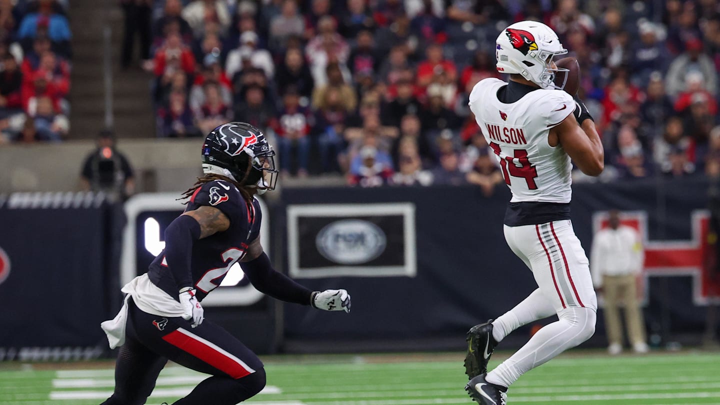 Dec 14, 2025; Houston, Texas, USA; Arizona Cardinals wide receiver Michael Wilson (14) catches a pass against Houston Texans cornerback Derek Stingley Jr. (24) in the third quarter at NRG Stadium. Mandatory Credit: Thomas Shea-Imagn Images