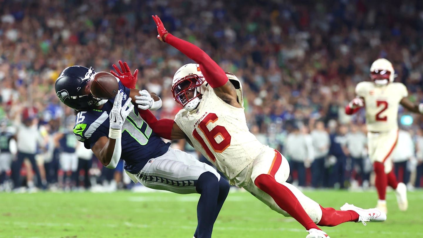 Sep 25, 2025; Glendale, Arizona, USA;  Seattle Seahawks wide receiver Tory Horton (15) cannot make a catch against Arizona Cardinals cornerback Max Melton (16) in the second quarter at State Farm Stadium. Mandatory Credit: Mark J. Rebilas-Imagn Images