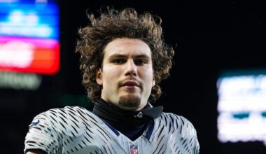 AJ Barner of the Seattle Seahawks runs onto the field