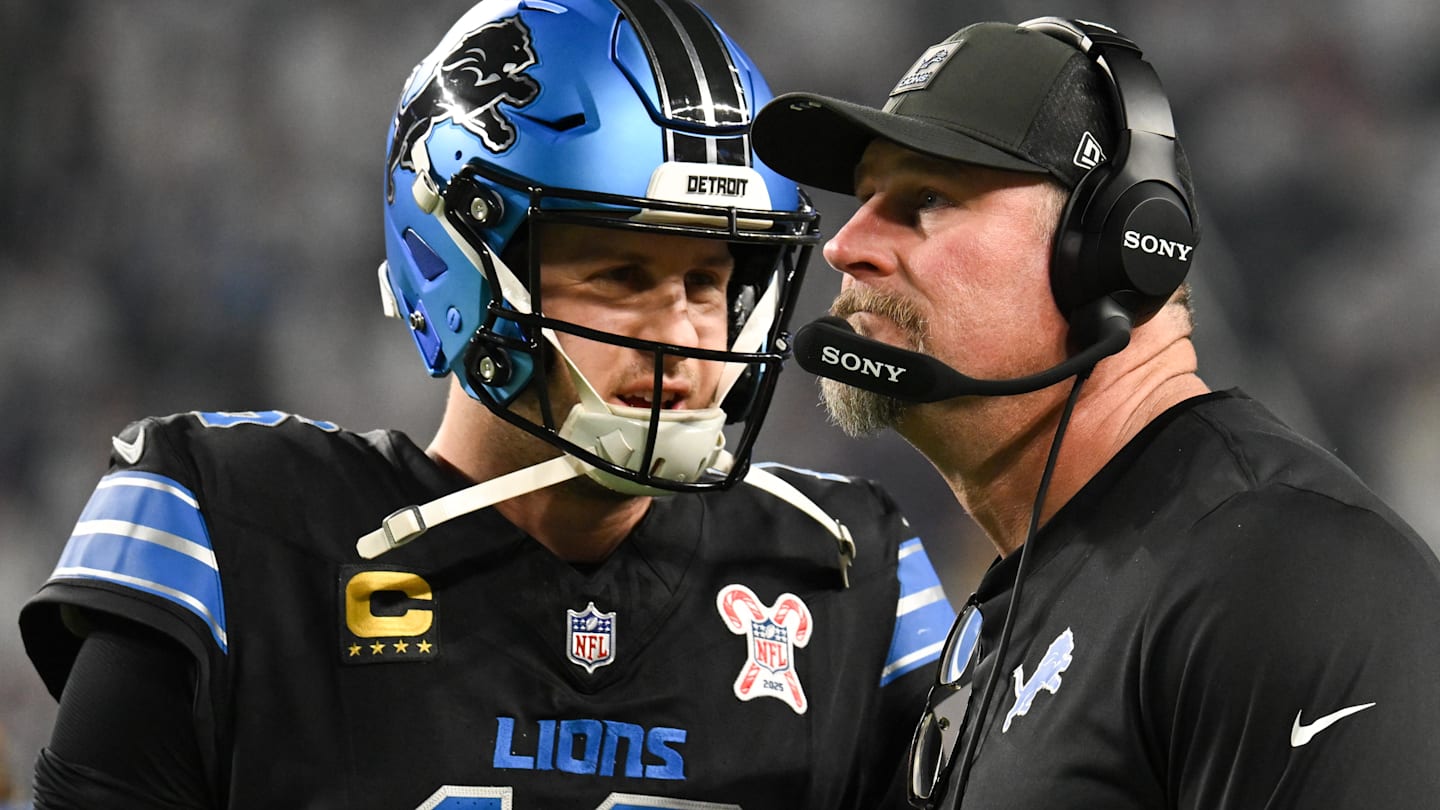 Dec 25, 2025; Minneapolis, Minnesota, USA; Detroit Lions quarterback Jared Goff (16) speaks with head coach Dan Campbell in the second quarter against the Minnesota Vikings at U.S. Bank Stadium.