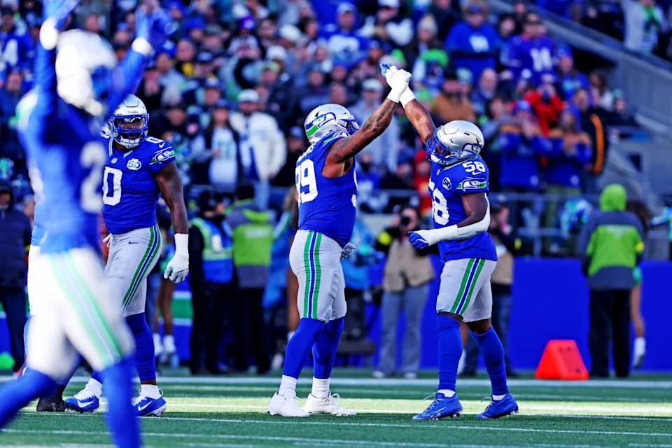 Nov 30, 2025; Seattle, Washington, USA; Seattle Seahawks defensive end Leonard Williams (99) and Seattle Seahawks linebacker Derick Hall (58) celebrate after a play during the first half against the Minnesota Vikings at Lumen Field. Mandatory Credit: Kevin Ng-Imagn Images© Kevin Ng-Imagn Images&period;