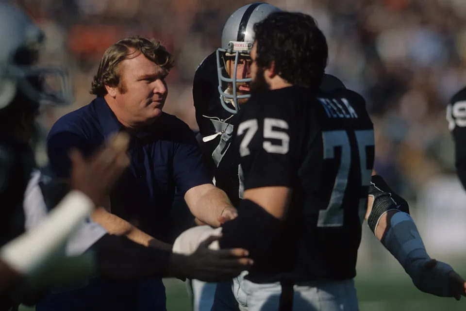 Football: Oakland Raiders coach John Madden on sidelines with John Matuszak (72) and John Vella (75) during game vs New England Patriots at Oakland-Alameda County Coliseum.<br>Oakland, CA 12/18/1976Peter Read Miller&sol;Getty Images