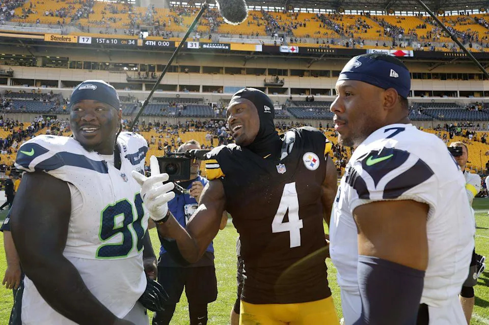 DK Metcalf #4 of the Pittsburgh Steelers talks with his former Seahawks teammates Uchenna Nwosu #7 and Jarran Reed #90 of after Seattle beat the Steelers 31-17 at Acrisure Stadium September 14, 2025 in Pittsburgh, Pennsylvania. (Photo by Justin K. Aller/Getty Images)