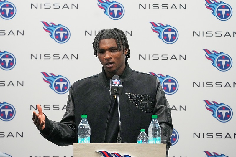 Tennessee Titans quarterback Cam Ward talks during a news conference after an NFL football game between the Tennessee Titans and the Jacksonville Jaguars Sunday, Nov. 30, 2025, in Nashville, Tenn. (AP Photo/George Walker IV)