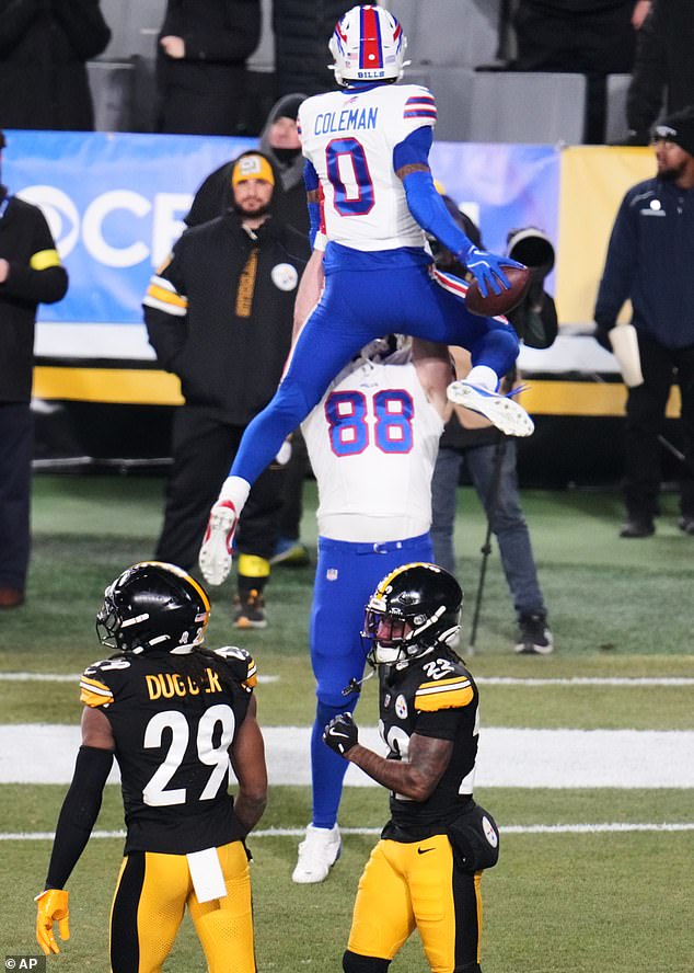 Bills receiver Keon Coleman (0) celebrates with tight end Dawson Knox after a touchdown
