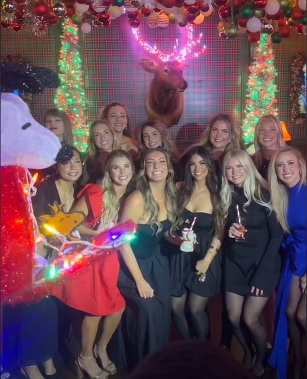 Taylor Swift (back left) was spotted with Kansas City Chiefs WAGs at a Christmas party