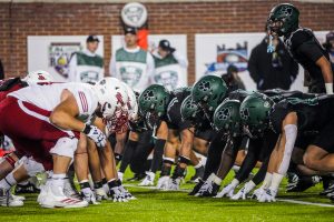 Ohio's defensive line lining up against Miami's offensive line during a critical goal-line stand in the first half.