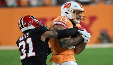 Tampa Bay Buccaneers wide receiver Mike Evans (13) runs after a catch against Atlanta Falcons safety Xavier Watts (31) during the first half of an NFL football game, Thursday, Dec. 11, 2025, in Tampa, Fla. (AP Photo/Jason Behnken)