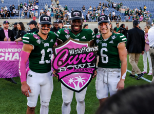 Ohio Football quarterback Parker Navarro (left), running back Anthony Tyus (middle) and wide receiver Coleman Owen (right) posing for a photo after winning the 2024 Cure Bowl.