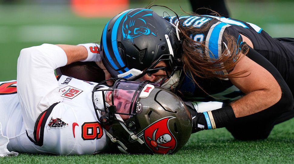 Tampa Bay Buccaneers quarterback Baker Mayfield is sacked by Carolina Panthers linebacker Christian Rozeboom during the first half of an NFL football game, Sunday, Dec. 21, 2025, in Charlotte, N.C. (AP Photo/Erik Verduzco)
