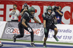 Ohio Football safety DJ Walker (right) celebrating with the ball after his interception in the Frisco Bowl vs UNLV.