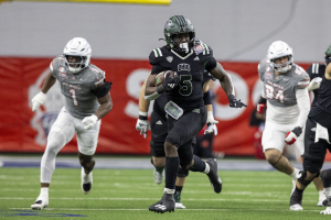 Ohio Football running back Sieh Bangura carrying the ball against UNLV in the Frisco Bowl. 