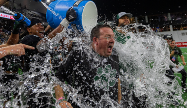 Ohio Football interim head coach John Hauser getting splashed with water after winning the Frisco Bowl.