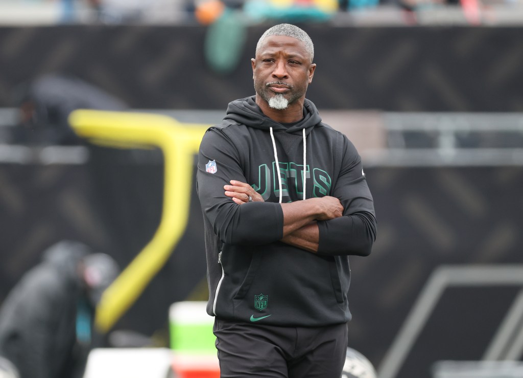 New York Jets head coach Aaron Glenn reacts on the field during warm up before the start of the game.