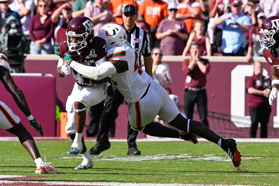 Miami Hurricanes defensive lineman Rueben Bain Jr. (4) tackles Texas A&M Aggies wide receiver KC Concepcion (7) during the game between the Aggies and the Hurricanes at Kyle Field.<br>Jerome Miron-Imagn Images