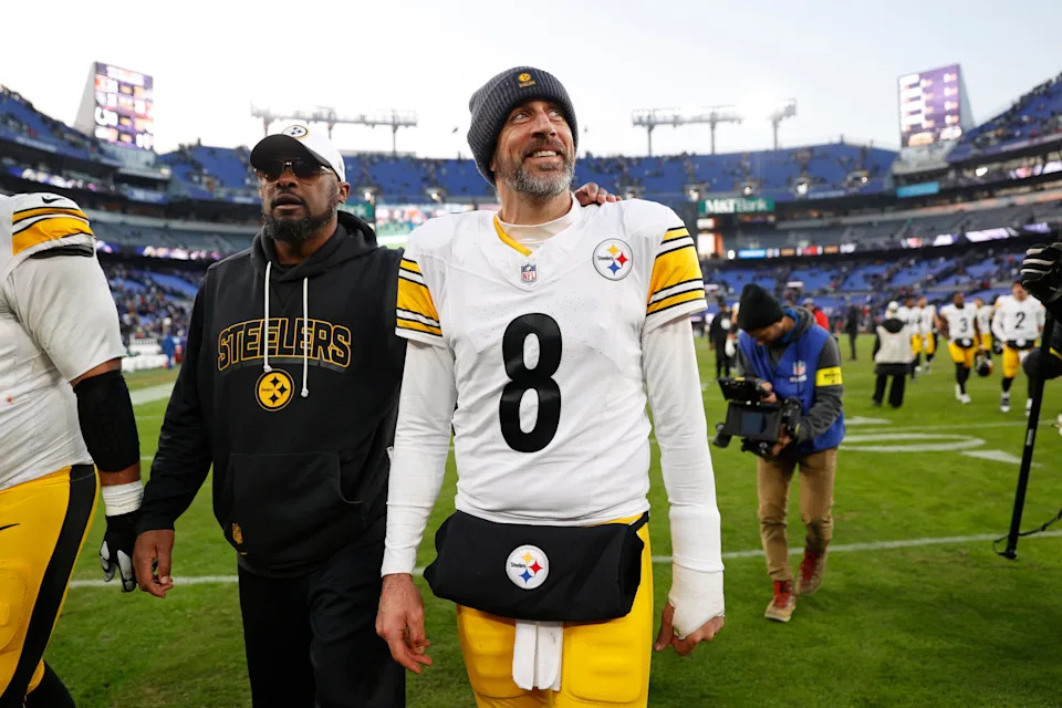 Dec 7, 2025; Baltimore, Maryland, USA; Pittsburgh Steelers head coach Mike Tomlin and quarterback Aaron Rodgers (8) walk off the field after the game against the Baltimore Ravens at M&T Bank Stadium. Mandatory Credit: Peter Casey-Imagn Images