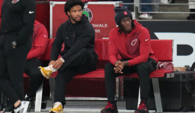 Arizona Cardinals quarterback Kyler Murray, left, and wide receiver Marvin Harrison Jr. sit on the bench during the first half of an NFL football game against the Jacksonville Jaguars Sunday, Nov. 23, 2025, in Glendale, Ariz. (AP Photo/Rick Scuteri)