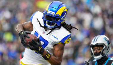 Los Angeles Rams wide receiver Davante Adams scores against the Carolina Panthers during the first half of an NFL football game, Sunday, Nov. 30, 2025, in Charlotte, N.C. (AP Photo/Jacob Kupferman)