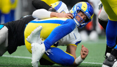 Los Angeles Rams quarterback Matthew Stafford is sacked by Carolina Panthers safety Lathan Ransom during the second half of an NFL football game, Sunday, Nov. 30, 2025, in Charlotte, N.C. (AP Photo/Jacob Kupferman)