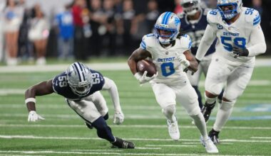 Detroit Lions running back Jahmyr Gibbs (0) runs the ball as Dallas Cowboys linebacker Jr. Kenneth Murray (59) tries to stop him during the first half of an NFL football game Thursday, Dec. 4, 2025, in Detroit. (AP Photo/Paul Sancya)