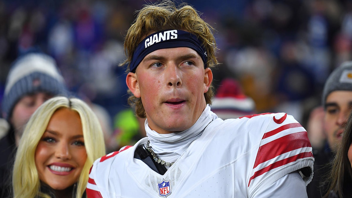 Jaxson Dart looks on