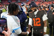 Tennessee Titans quarterback Cam Ward, left, and Cleveland Browns quarterback Shedeur...