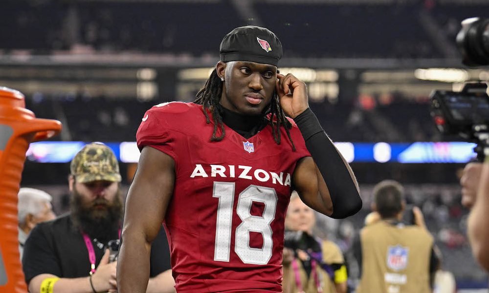 Cardinals WR Marvin Harrison Jr. (#18) on the field during a 2025 matchup versus Cowboys.