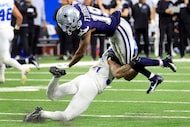 Dallas Cowboys wide receiver Ryan Flournoy (19) tries to elude the tackle by Detroit Lions...