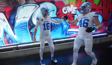 Detroit Lions quarterback Jared Goff (16) and linebacker Jack Campbell bump fists prior to an NFL football game against the Dallas Cowboys Thursday, Dec. 4, 2025, in Detroit. (AP Photo/Paul Sancya)