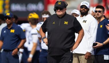 Biff Poggi tells signees and parents Michigan hopes to hire a coach by end of month, AP source says