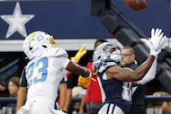 Dallas Cowboys wide receiver Ryan Flournoy (18) catches a pass to score under pressure from...