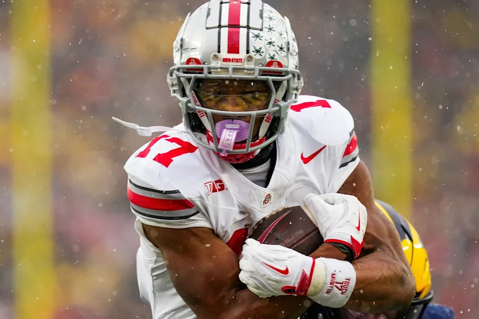 Ohio State Buckeyes wide receiver Carnell Tate (17) runs in a touchdown against the Michigan Wolverines in the second half of the NCAA football game at Michigan Stadium on Saturday, Nov. 29, 2025 in Ann Arbor, Michigan.